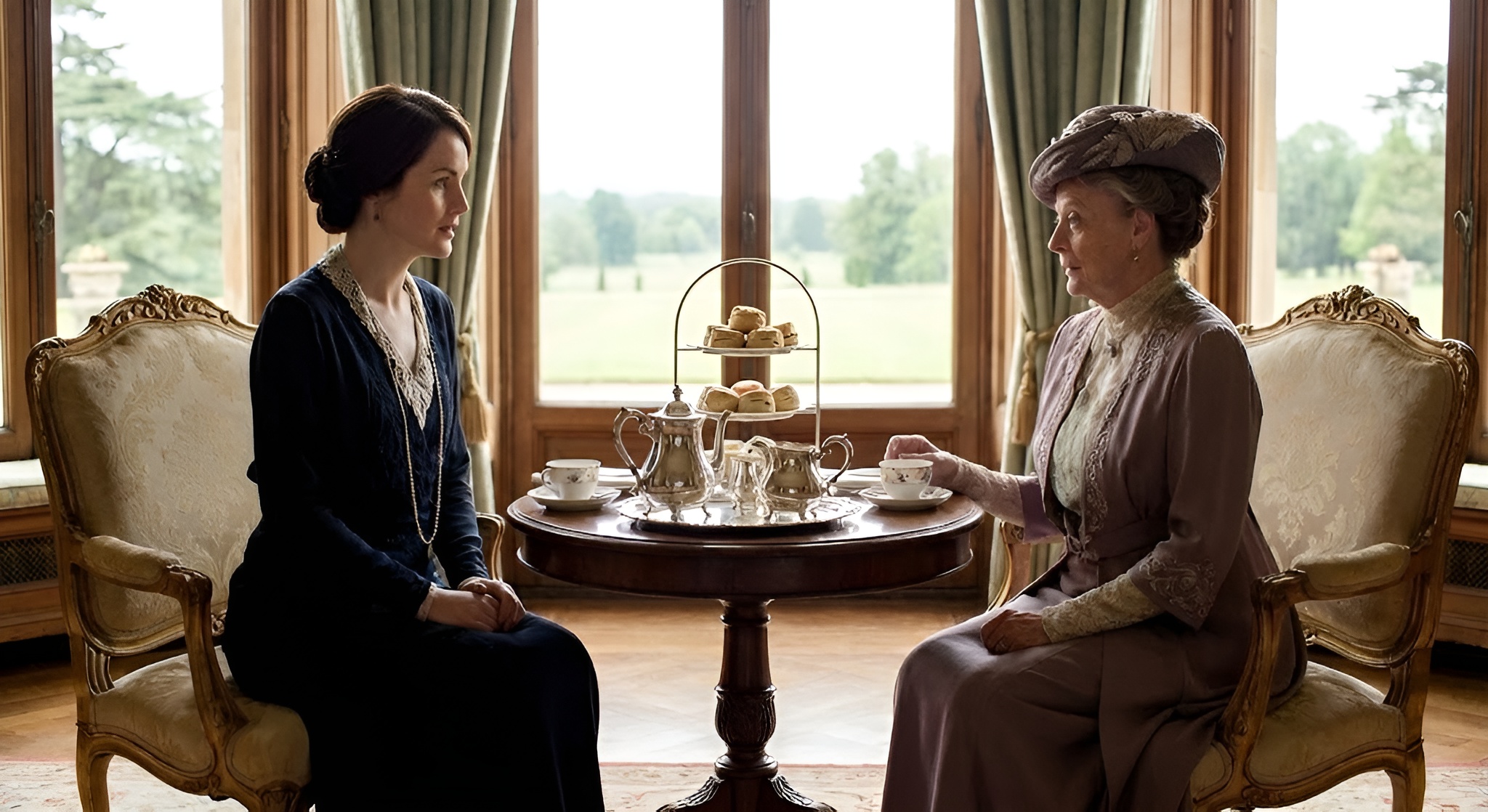 A scene from Downton Abbey featuring an elegant silver tea service in the library.