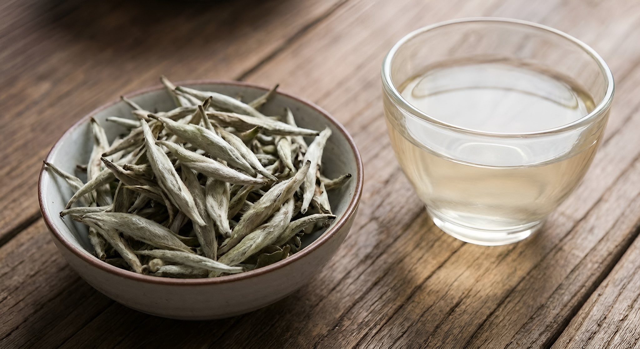 Macro shot of Silver Needle buds covered in white trichomes (hairs).